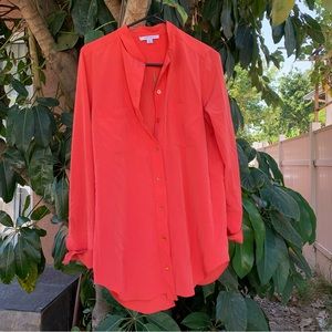 Carven designer button down blouse with an slit and open back!